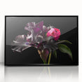 Framed black wall art showcasing a botanical peony design with vibrant colors and intricate details, ideal for modern home decor or floral-themed interiors.