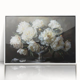 Framed botanical wall art featuring a vibrant peony design in shades of pink and green, displayed in a sleek white frame, perfect for home decor enhancement.