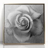 Framed wall art showcasing a botanical rose design with vibrant pink and green hues, accented by a sleek gold frame, perfect for enhancing home decor.