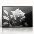 Framed wall art featuring a botanical rose design in vibrant pinks and greens, set in a sleek black frame, perfect for home decor or floral-themed interiors.