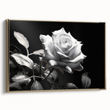 Framed botanical wall art showcasing a delicate rose design on canvas, accented with a gold frame, perfect for enhancing home decor elegance and style.