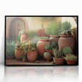 Framed wall art featuring a botanical design of vibrant succulents in an acrylic finish, set against a sleek black frame, perfect for modern decor.