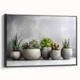 Framed wall art showcasing a botanical succulent design on canvas, featuring vibrant green hues and intricate details, displayed against a black background. Perfect for home decor.