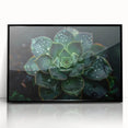 Framed botanical wall art featuring a vibrant succulent design in black acrylic. Perfect for modern home decor, adding a touch of nature to any room.