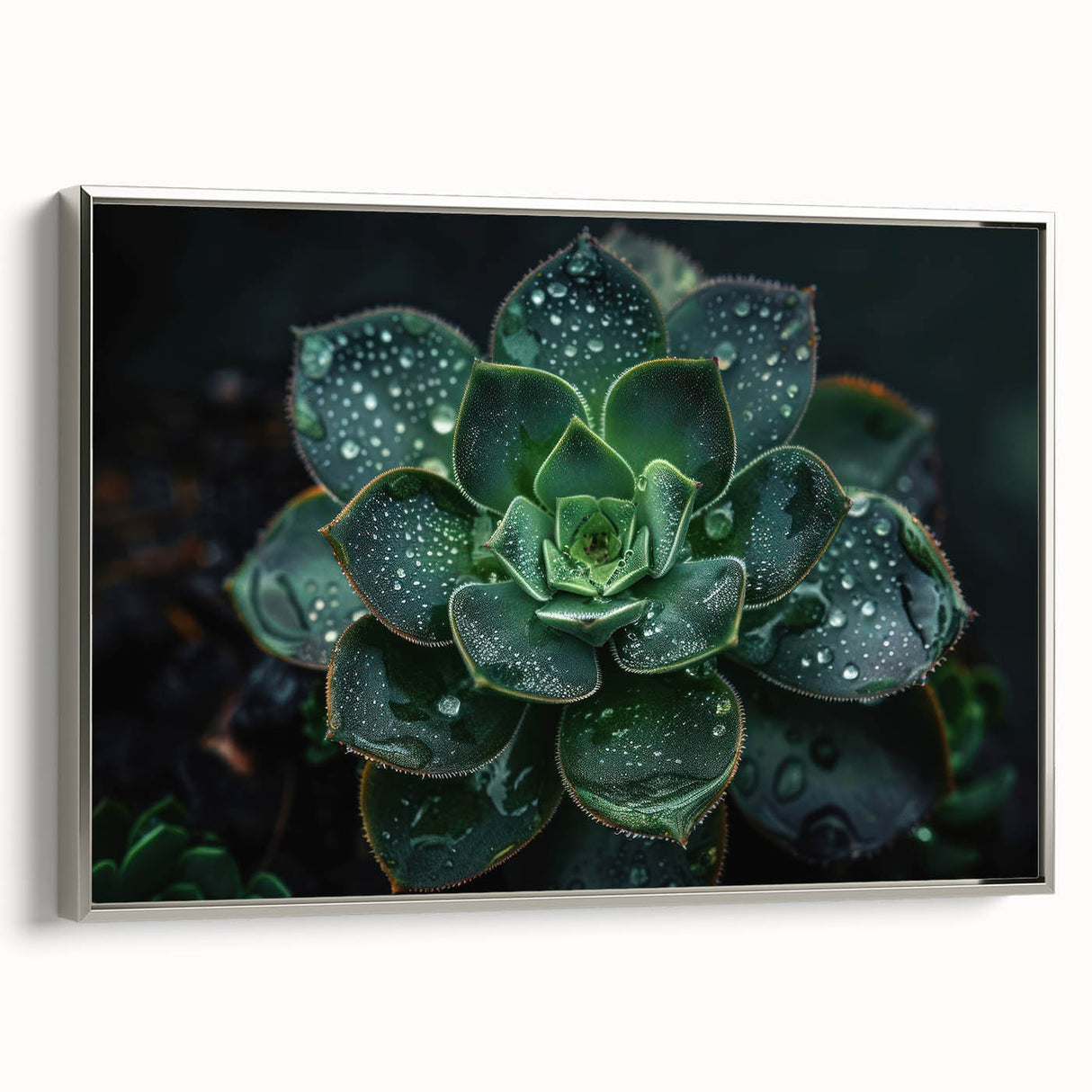 Framed wall art featuring a botanical design of succulents in vibrant greens and silvers, elegantly displayed with a sleek silver frame, perfect for home decor.