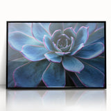 Framed wall art featuring a vibrant botanical design of assorted succulents, set in a sleek black frame, ideal for modern home decor and plant enthusiasts.