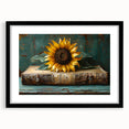 Botanical wall art featuring a vibrant sunflower design framed in black with a white mat, perfect for brightening home decor. Ideal for nature lovers.