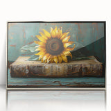 Framed botanical wall art featuring a detailed sunflower design with vibrant yellow petals and green leaves, set in a silver frame, perfect for home decor.