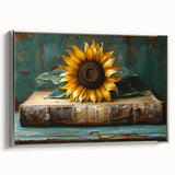 Framed canvas wall art featuring a botanical sunflower design with vibrant yellow petals and a sleek silver frame, ideal for home decor.