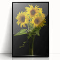 Framed wall art featuring a botanical sunflower design in vibrant yellow and green hues, set against a sleek black frame, ideal for home decor.