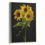 Framed botanical wall art featuring a vibrant sunflower design on a textured canvas, elegantly displayed with a silver frame, perfect for home decor.