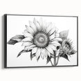 Framed wall art featuring a vibrant botanical sunflower design on canvas, showcasing a black frame. The artwork captures the intricate details of sunflowers, enhancing any decor with a natural touch. Perfect for brightening living spaces or adding a floral accent to home interiors.