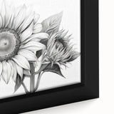 Close-up of a beautifully framed botanical sunflower wall art piece, showcasing vibrant yellow petals against a textured background, perfect for brightening home decor.