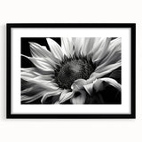 Botanical wall art featuring a vibrant sunflower design, framed in black with a mat, showcasing a modern aesthetic perfect for home decor.