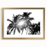 Botanical-themed wall art featuring a framed design of vibrant flowers and trees, accented with a gold frame and mat, ideal for enhancing home decor.