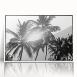 Framed botanical wall art featuring a collection of delicate flowers and trees in soft colors, displayed against a white background, ideal for home decor enhancement.