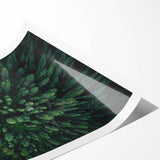 Rolled botanical wall art featuring a vibrant floral tree design, showcasing intricate details in shades of green and pink, perfect for home decor.