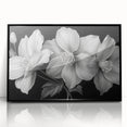Framed wall art showcasing a vibrant tropical flower design, featuring rich colors and intricate details, set against a sleek black frame, perfect for home decor.