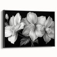Framed canvas wall art showcasing a vibrant tropical flower design with botanical elements in rich colors, set against a sleek black background, perfect for home decor.