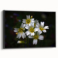 Framed canvas artwork showcasing a vibrant tropical flower design with intricate botanical details, featuring a sleek black frame and displayed in a modern setting.