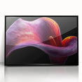 Framed wall art showcasing a vibrant botanical tropical flower design with a black frame, ideal for home decor and enhancing interior aesthetics.