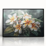 Framed wall art showcasing a vibrant botanical tropical flower design with a black frame, ideal for enhancing home decor with a touch of nature's elegance.