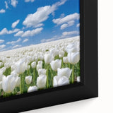 Close-up of a framed botanical wall art piece featuring vibrant tulips in various shades of pink and yellow, showcasing intricate details and textures against a soft background. Perfect for brightening up any living space or office decor.