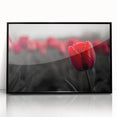 Framed botanical wall art showcasing a vibrant tulip design with a black frame, perfect for modern home decor. Adds a touch of elegance to any room.