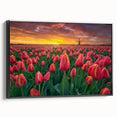 Framed botanical wall art featuring a vibrant tulip design on canvas, presented in a sleek black frame, showcasing its elegant side profile against a neutral backdrop.