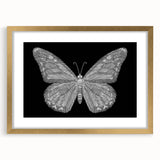 Elegant gold-framed wall art featuring a detailed butterfly design, surrounded by a white mat. This stylish decor piece enhances any room with its intricate insect and arachnid theme, perfect for nature lovers and modern interiors.