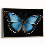 Framed wall art showcasing a colorful butterfly design on canvas, featuring intricate details and a gold frame, ideal for nature-themed decor.