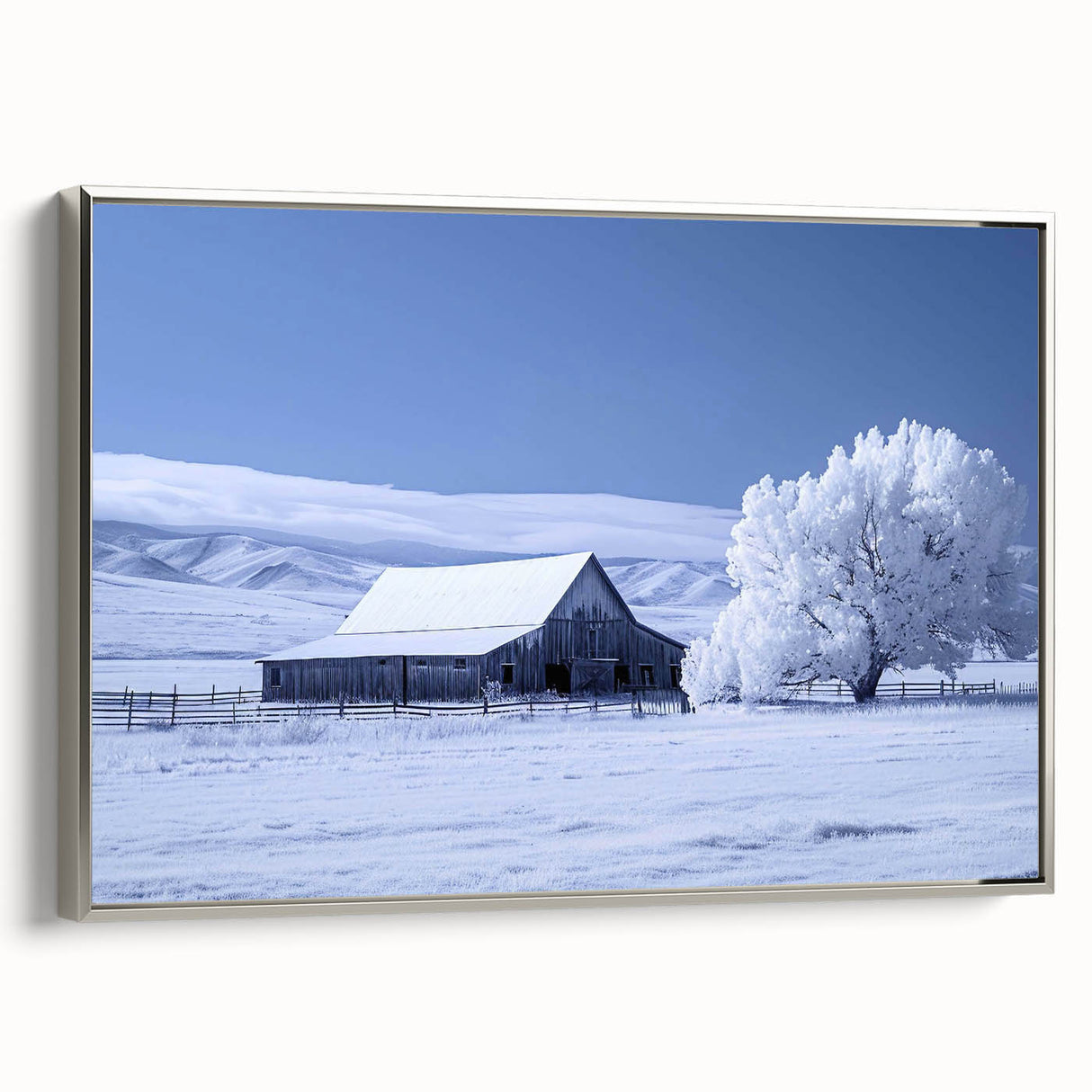 Framed canvas wall art showcasing a serene landscape with a rustic barn, enhanced by silver detailing, ideal for home decor. Perfect for farmhouse-style interiors.
