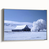 Framed canvas wall art showcasing a serene landscape with a rustic barn, enhanced by silver detailing, ideal for home decor. Perfect for farmhouse-style interiors.