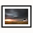 Framed black wall art featuring a picturesque barn landscape design, ideal for rustic decor, with a white mat enhancing its visual appeal.