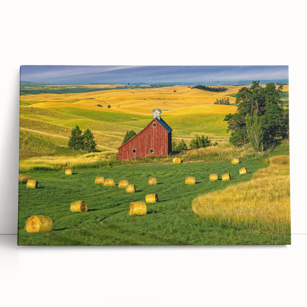 Stretched canvas artwork showcasing a serene landscape with a rustic barn, featuring vibrant colors and detailed textures, perfect for home decor or office ambiance.