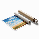 Rustic barn landscape wall art print showcasing a serene countryside scene with vibrant greens and blues, rolled for easy display and shipping.