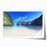 Vibrant beach landscape wall art print showcasing a serene sunset over gentle waves, rolled and ready for display, perfect for coastal home decor.