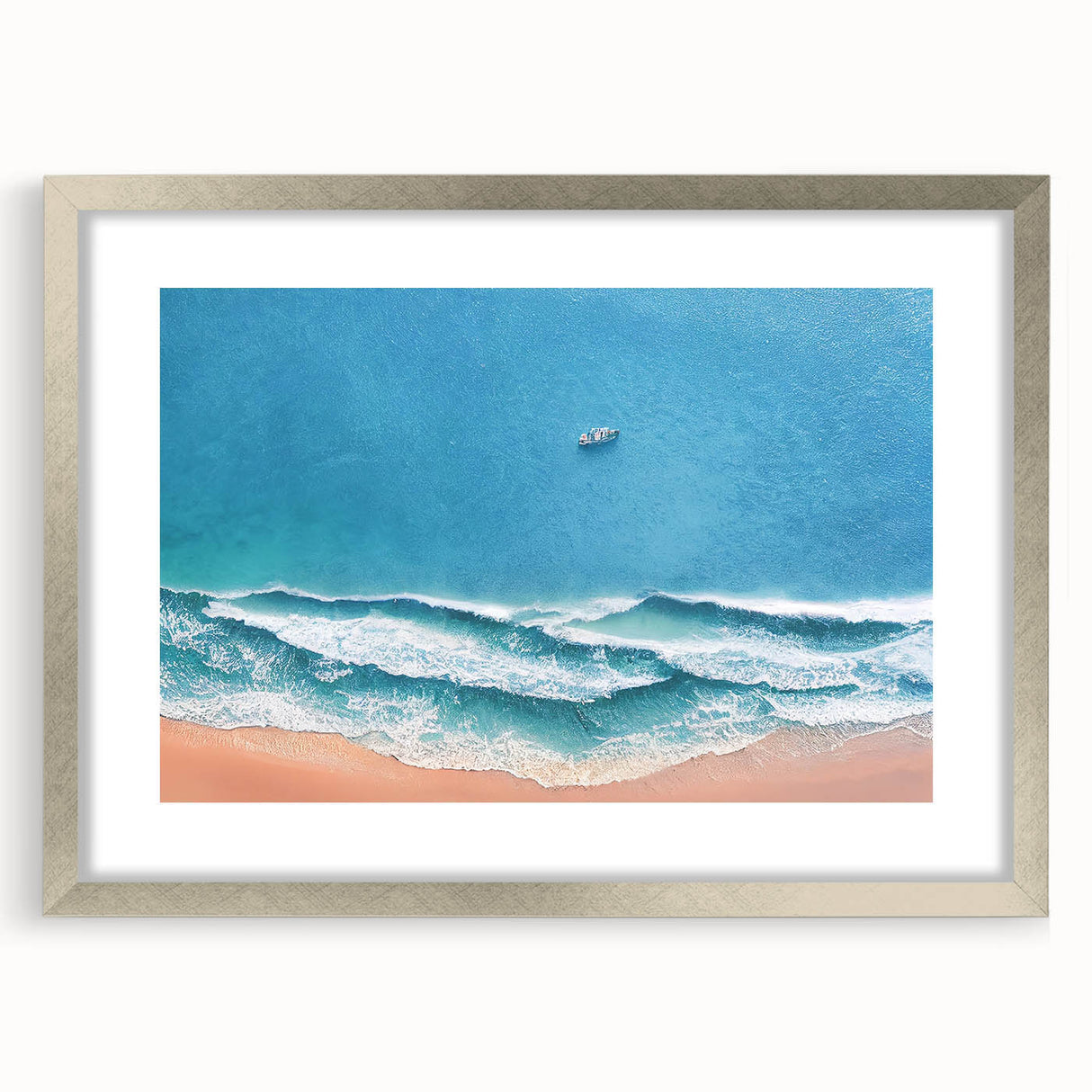 Framed wall art featuring a serene beach landscape design with a silver mat, perfect for home decor. Ideal for creating a calming atmosphere in any room.