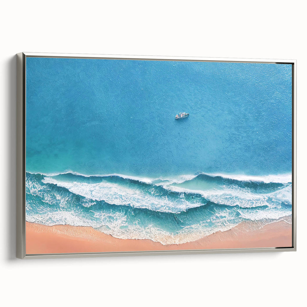 Framed canvas wall art showcasing a serene beach landscape, featuring vibrant colors and a silver frame, ideal for enhancing home decor with coastal charm.
