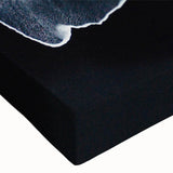 Close-up of a vibrant stretched canvas wall art featuring a serene beach landscape design, showcasing colorful waves and soft sandy hues, ideal for home decor.