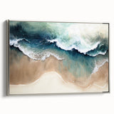 Framed canvas wall art featuring a serene beach landscape with soft waves and a pastel sunset, enhanced by a sleek silver frame, perfect for home decor.