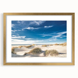 Elegant gold-framed wall art featuring a serene beach landscape design, complete with a white mat, ideal for enhancing home decor and creating a calming atmosphere.