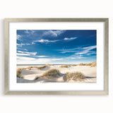 Framed wall art collection featuring serene beach landscapes with a silver mat, perfect for adding a coastal vibe to home decor. Ideal for living rooms or offices.