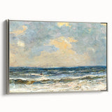 Framed canvas wall art showcasing a serene beach landscape with soft waves and golden sand, accented by a sleek silver frame, ideal for coastal decor.