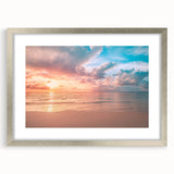Framed wall art collection showcasing serene beach landscapes with a silver mat, perfect for enhancing modern home decor. Ideal for coastal-themed interiors.