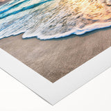 Vibrant rolled canvas artwork showcasing a serene beach landscape with soft waves and a clear blue sky, elegantly designed for home decor. Perfect for creating a calming atmosphere.