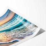 Vibrant beach landscape wall art print showcasing a serene sunset over waves, rolled for easy display and shipping, ideal for home decor enthusiasts.