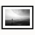 Framed black wall art featuring a serene beach landscape design, showcasing soft blue waves and sandy shores, perfect for home decor enhancement.
