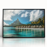 Framed acrylic wall art depicting a serene beach landscape, showcasing vibrant blues and sandy tones, ideal for coastal home decor. The artwork has a sleek black frame, enhancing its modern aesthetic.
