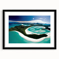 Black-framed wall art featuring a serene beach landscape scene with soft waves and golden sand, ideal for home decor or office spaces, enhancing tranquility.